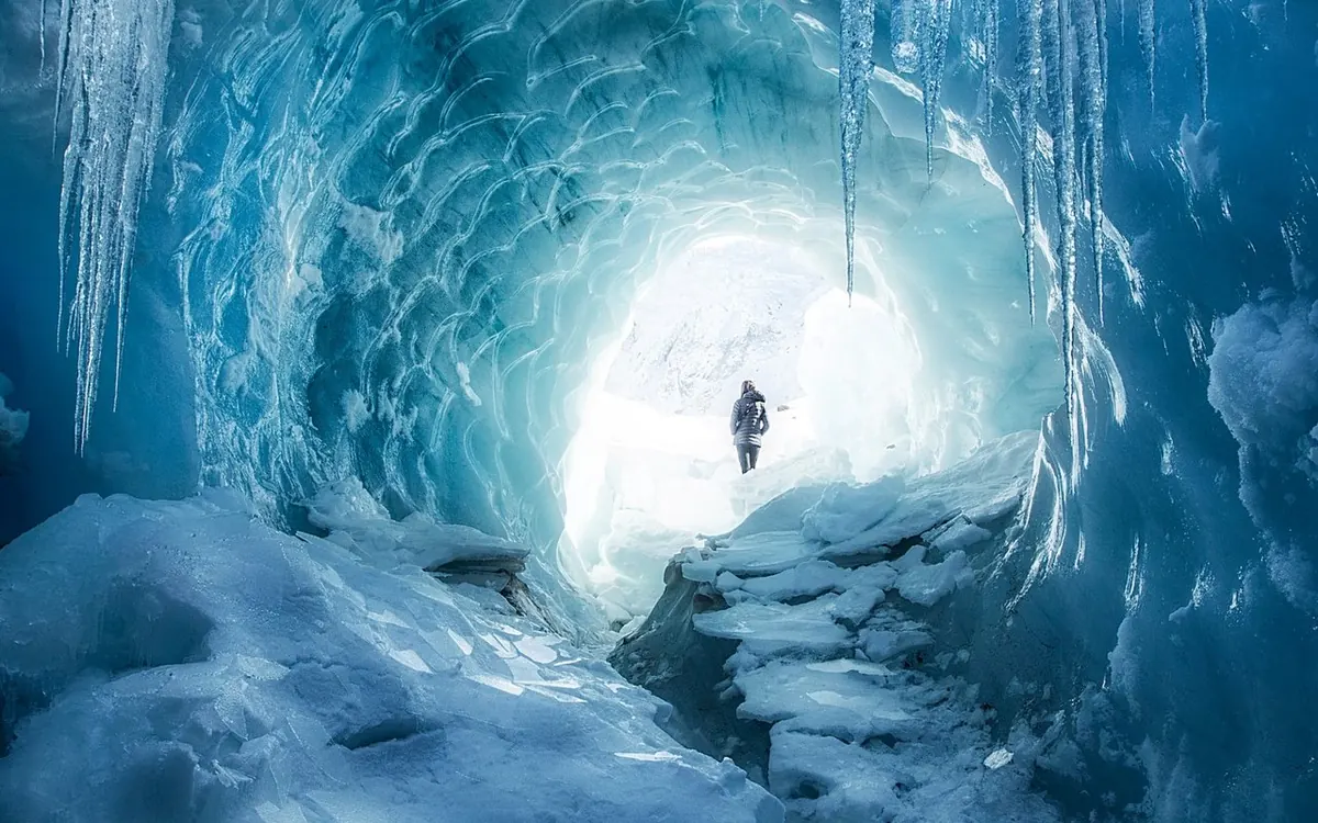 A guided group in crampons on the ice of the Tasman Glacier