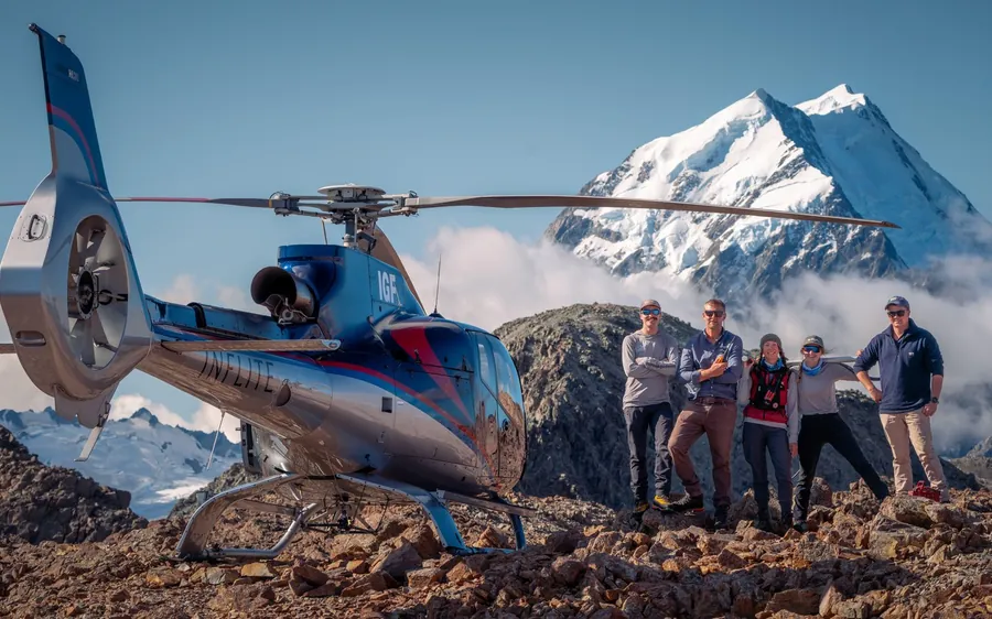 A helicopter parked on a snowfield above the Tasman Glacier