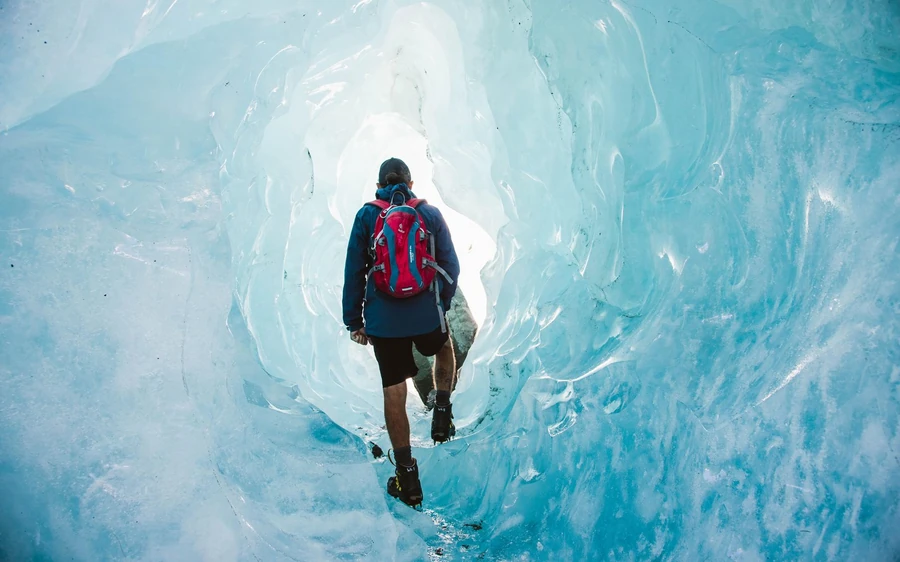 A guided group in crampons walking on the Tasman Glacier